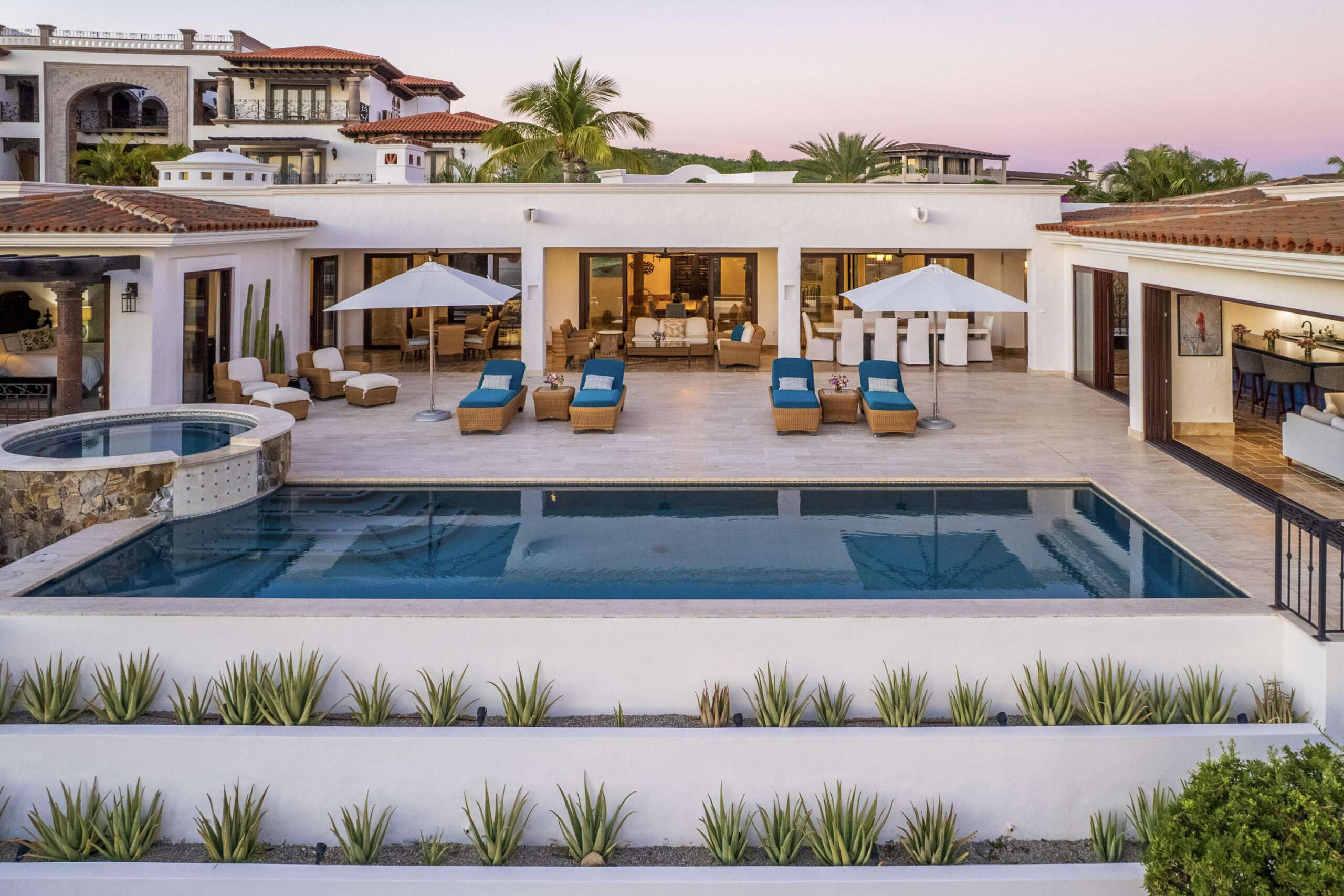 Cabo Luxury Fundadores Fully remodeled with entertaining in mind, Casa Reino is a stunning Spanish Colonial-style residence located within the double-gated Fundadores community of Puerto Los Cabos. Designed for hosting extended family and friends while maintaining exceptional privacy, this custom-built home blends timeless architecture with modern luxury and efficiency.An expansive pool terrace invites relaxed lounging under the renowned Los Cabos sunshine, complemented by shaded outdoor living and dining areas and multiple interior courtyards that provide privacy for guest suites. A brand-new bar, media, and entertainment room creates the perfect setting for dinner parties and special events.The thoughtful floor plan features a luxurious master suite with soaking tub and indoor/outdoor shower, along with four private guest suites, each positioned for comfort and seclusion. Modern upgrades throughout the home include all-new plumbing, air conditioning, doors, windows, lighting, and furnishings.Designed for efficiency and convenience, Casa Reino is equipped with a solar system, solar pool heater/chiller, and solar heat pump, keeping operating costs low. Additional highlights include an oversized two-car garage with commercial refrigerator and freezer, a new laundry room with dual washer/dryer sets, and a new BBQ cook center with wet bar, icemaker, and refrigeration. The pool has been newly refinished, exterior travertine decking installed, and a complete hurricane shutter system added.Residents of Puerto Los Cabos enjoy 27 holes of Nicklaus and Norman signature golf, with the option to transfer a golf membership at the purchaser's cost. Membership also includes access to tennis and pickleball courts. Fundadores HOA fees include exclusive access to the Fundadores Beach Club, featuring an oceanfront infinity pool, Jacuzzi, fitness center, event lawn, restaurant, and spa services.Ideally located just 5 minutes from the Puerto Los Cabos Marina, 10 minutes from downtown San José del Cabo, and 30 minutes from Los Cabos International Airport, Casa Reino offers effortless access to world-class dining, shopping, and lifestyle amenities.Special Features & UpgradesSolar system in placeSolar pool heater and chillerNewly remodeled pool with new finishesNew exterior travertine deckingNew bar / media / family roomNew laundry room with double washer & dryersNew air conditioning throughoutNew furnishingsNew kitchen appliances: refrigerator, two dishwashers, ice maker, beverage fridge & drawersNew sinks and faucets in kitchenSonos sound systemNew doors and windowsNew hurricane protection systemNew interior and exterior lightingCommercial refrigerator and freezer in garageNew countertops and cabinetry in kitchenette and bath at Guest Casita #4 for sale