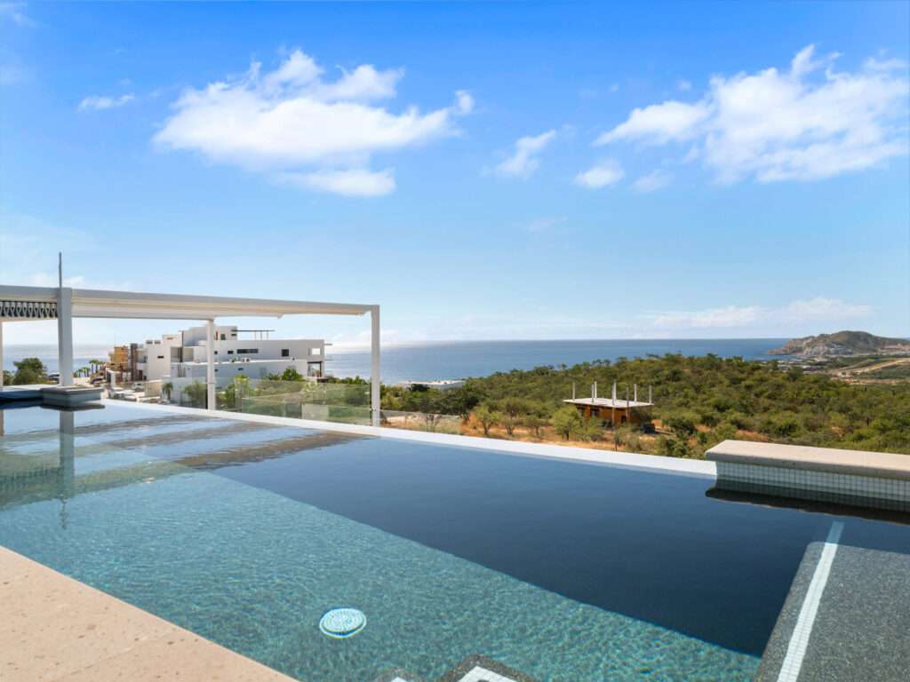 Cabo Luxury Section 4- Las Canadas Discover refined indoor-outdoor living at Cañada 9, set within Querencia, San Jose del Cabo's premier private golf community. Soaring beamed ceilings, walls of pocket glass, and luminous marble floors define an open great room that flows effortlessly to the terrace, infinity-edge pool, and stone-clad water feature -- all framed by panoramic Sea of Cortez and mountain – El Tule, San Jose Corridor, BS