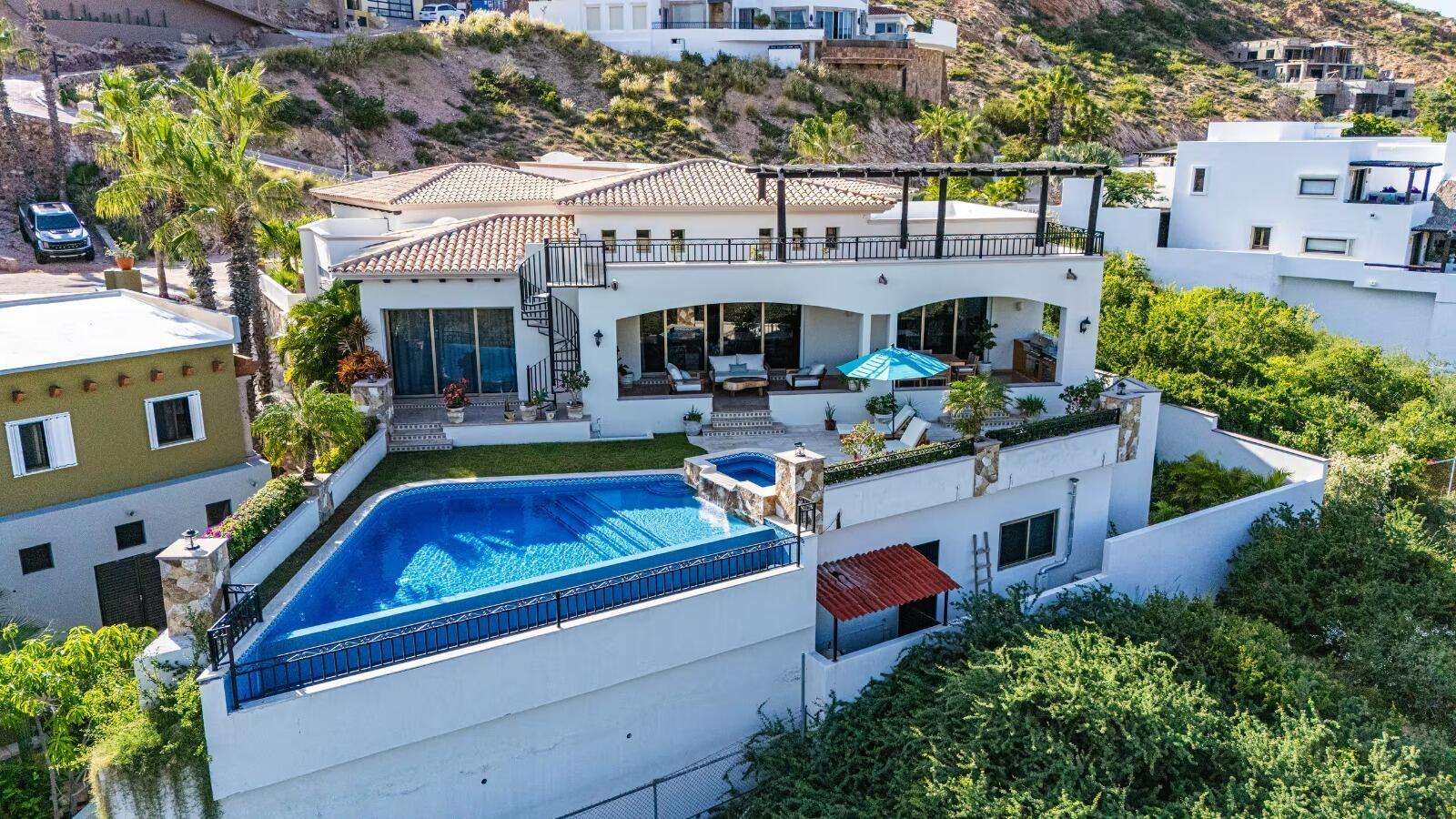 Cabo Luxury Cabo Colorado Architectural Elegance & Split-Wing Layout.This home is a triumph of modern architecture, beautifully finished with gorgeous marble floors throughout and premium granite countertops.A Grand Welcome: A generously sized entry foyer warmly ushers you into the home, setting a tone of spacious elegance from the very moment you arrive.Open-Concept Living: The main living room features dramatic vaulted ceilings, creating a grand, airy atmosphere. Sliding doors in both the living and dining room offer a seamless transition to the pool and outdoor deck while framing spectacular ocean – 35 Avenida Camino Real, San Jose Corridor, BS